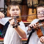 Boys playing violins - Cliff Hide