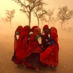 Girls Sheltering from a dust storm in Rajistan Steve McCurry